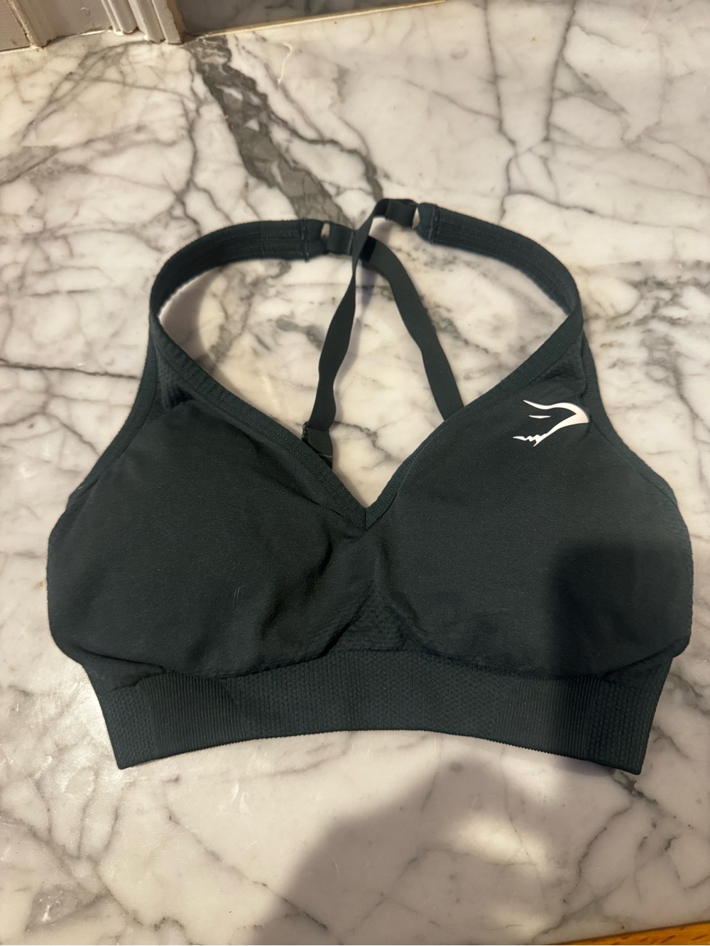 Gymshark Black Strappy V‑Neck Sports Bra with White Logo